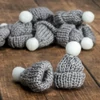 Kép 1/5 - Mini kötött sapka szürke 12db/cs