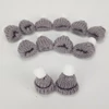 Mini kötött sapka szürke 12db/cs