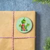 Kép 2/3 - Nyomtatott fa tábla - Grincs "HO HO HO" 3db/cs