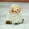 Kép 3/4 - Üldögélő bolyhos birka figura fehér